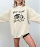 Pullover sweatshirt in the color sand that says "members only antisocial book club" for book lovers or bookish women.