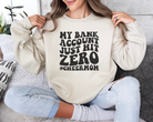 My bank account just hit zero cheer mom sweatshirt in sand.