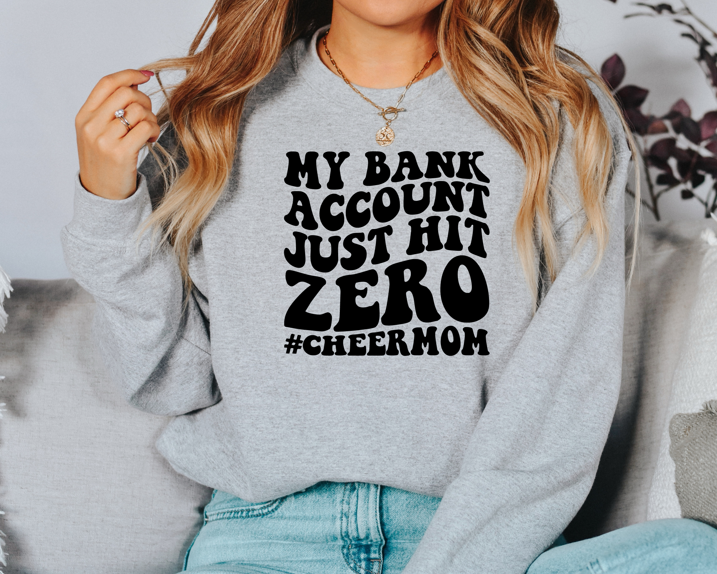 My bank account just hit zero cheer mom sweatshirt in gray.
