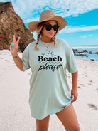 beach shirt that says beach please.  Subtle smaller designs around the words are bird sun waves and heart.  Made in the color bay in a comfort colors tee.