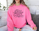 Funny cheer sweatshirt that says boys throw balls cheerleaders throw people in safety pink