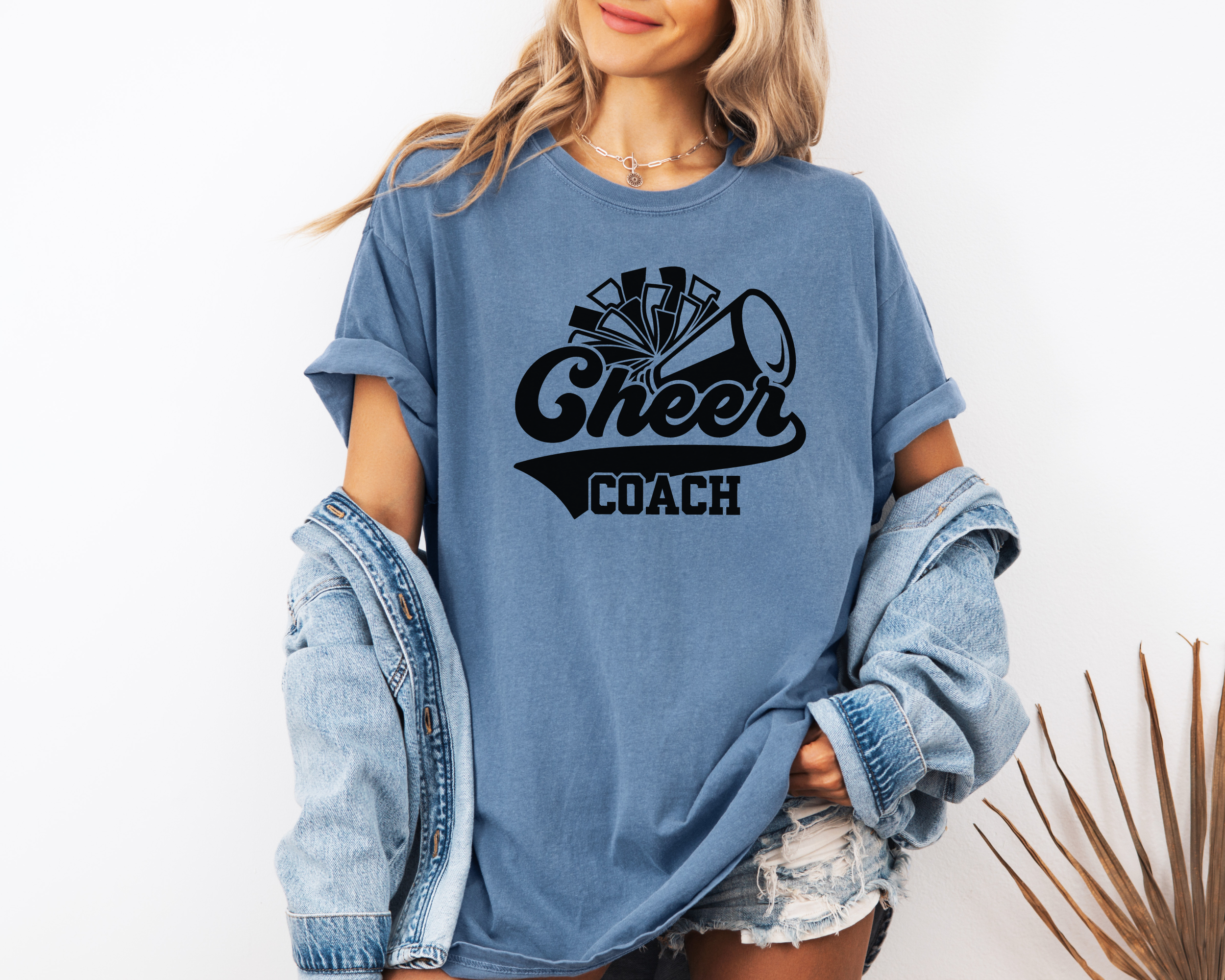 Retro cheer coach shirt with a pom pom and a megaphone.