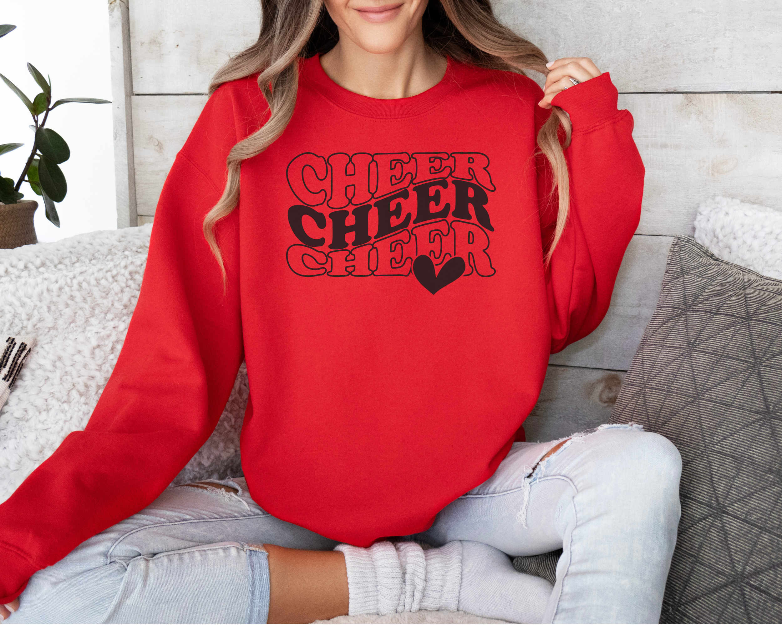 Red Cheer sweatshirt in in a wavy stacked text with a heart.