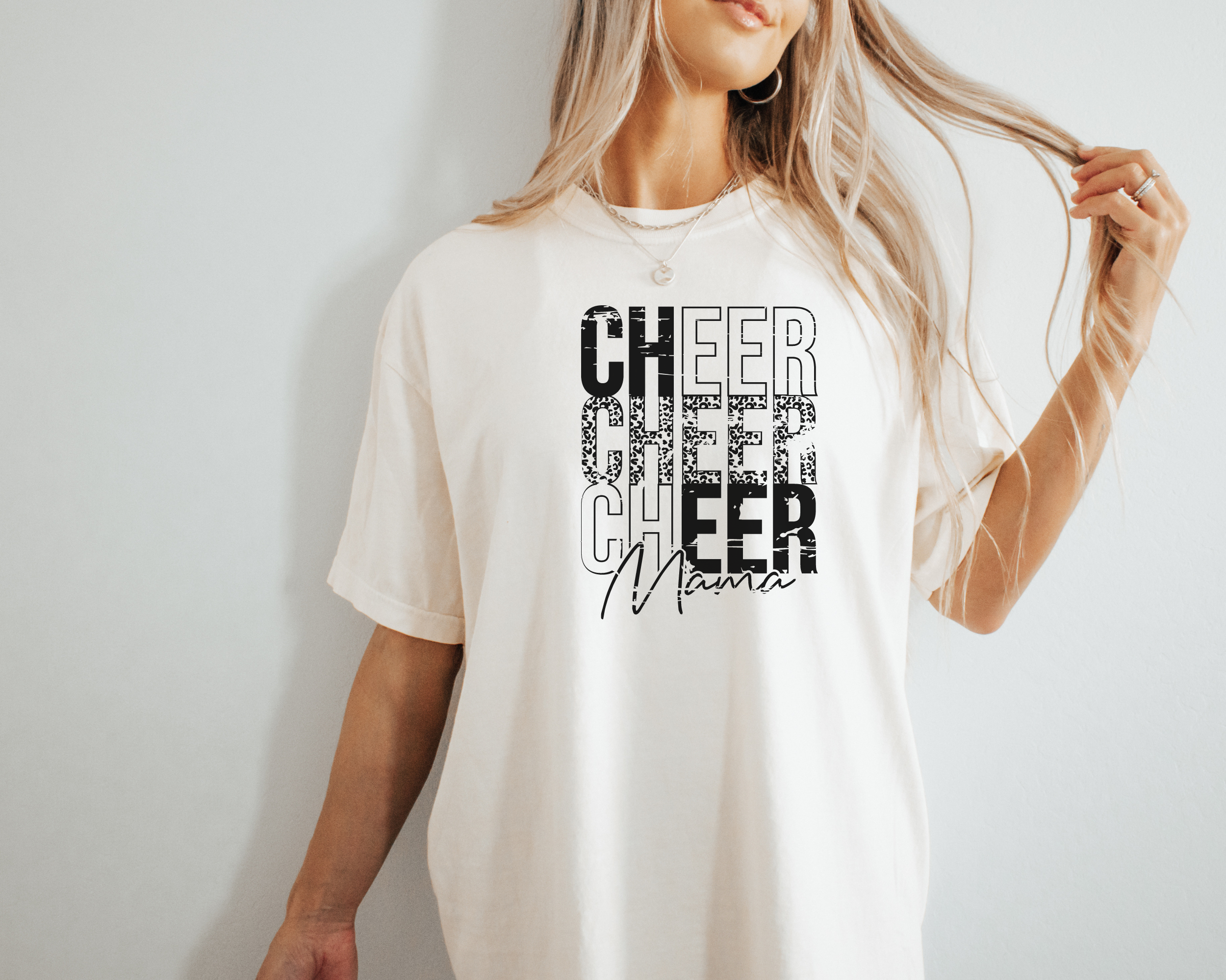 cheer mama stacked tshirt with a distressed cheetah print design in the color ivory