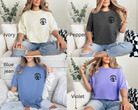 Football mom shirts in ivory, pepper, blue jean, and violet.