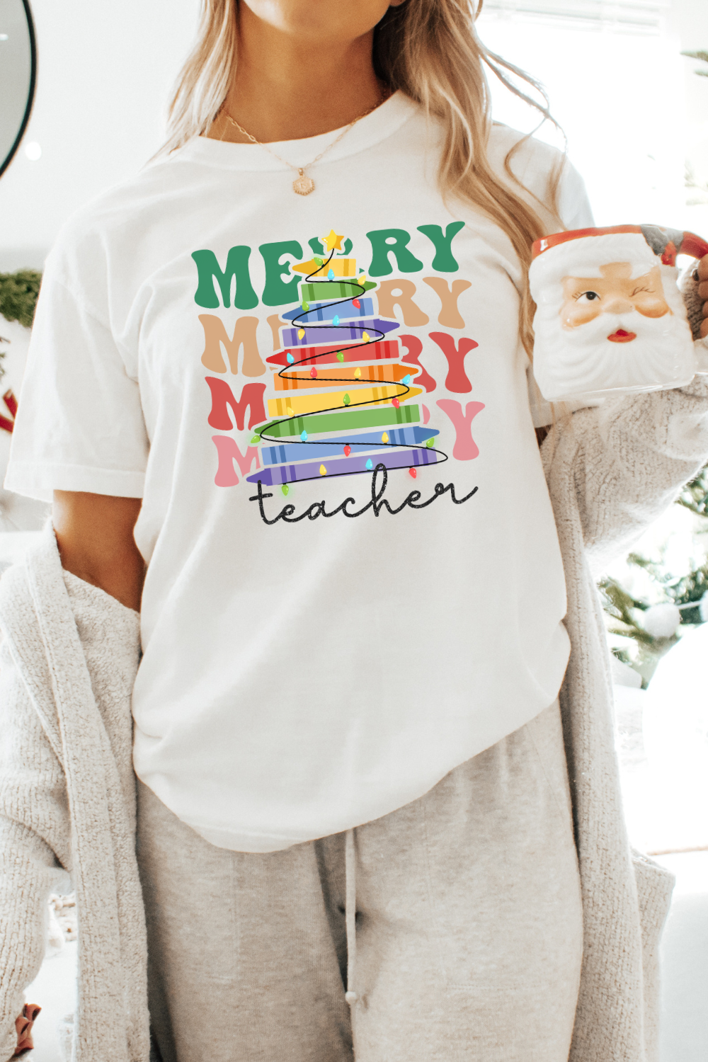 Cute Christmas tshirt for teachers that says merry teacher stacked with a crayon tree.