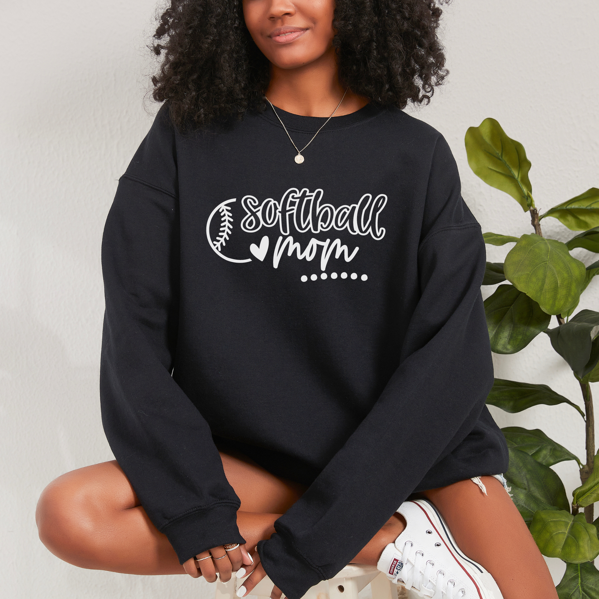 Softball mom sweatshirt made in a black pullover sweatshirt with a white design