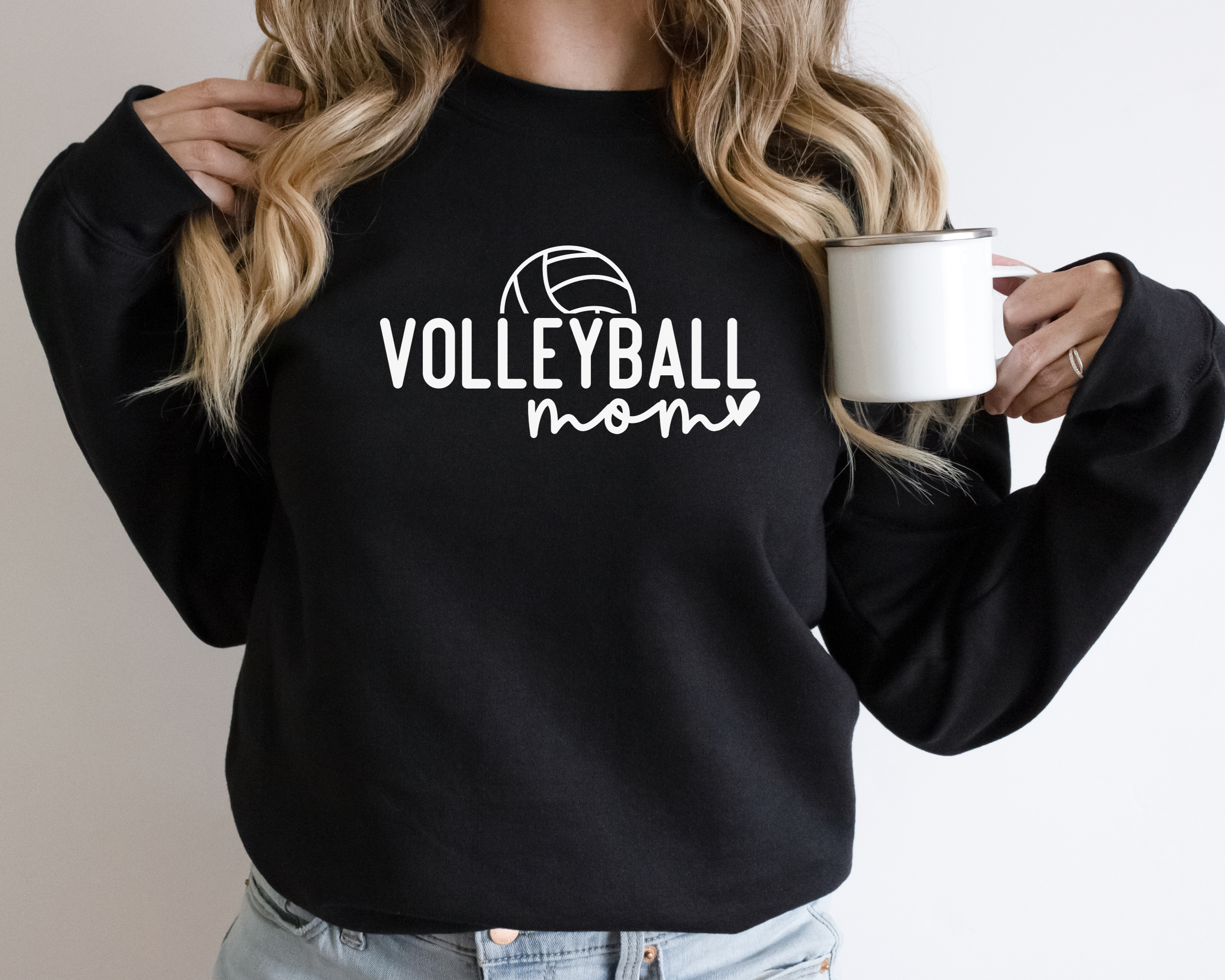 Black colored volleyball mom sweatshirt with white design